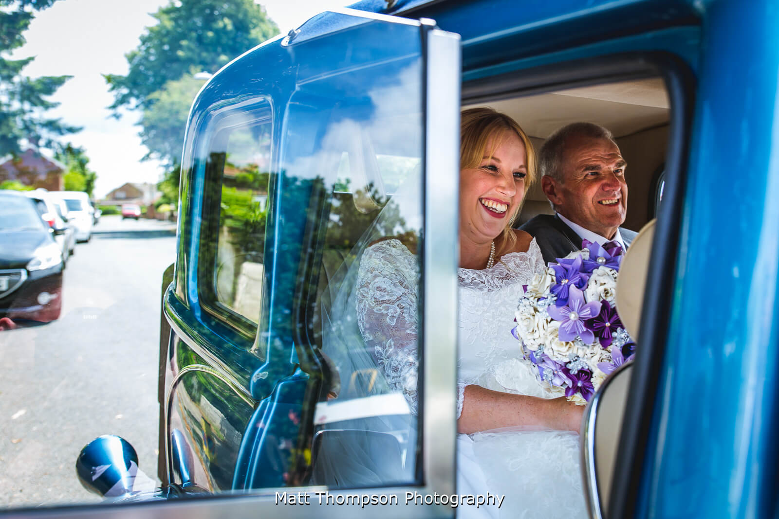 smiling bride and father of the bride