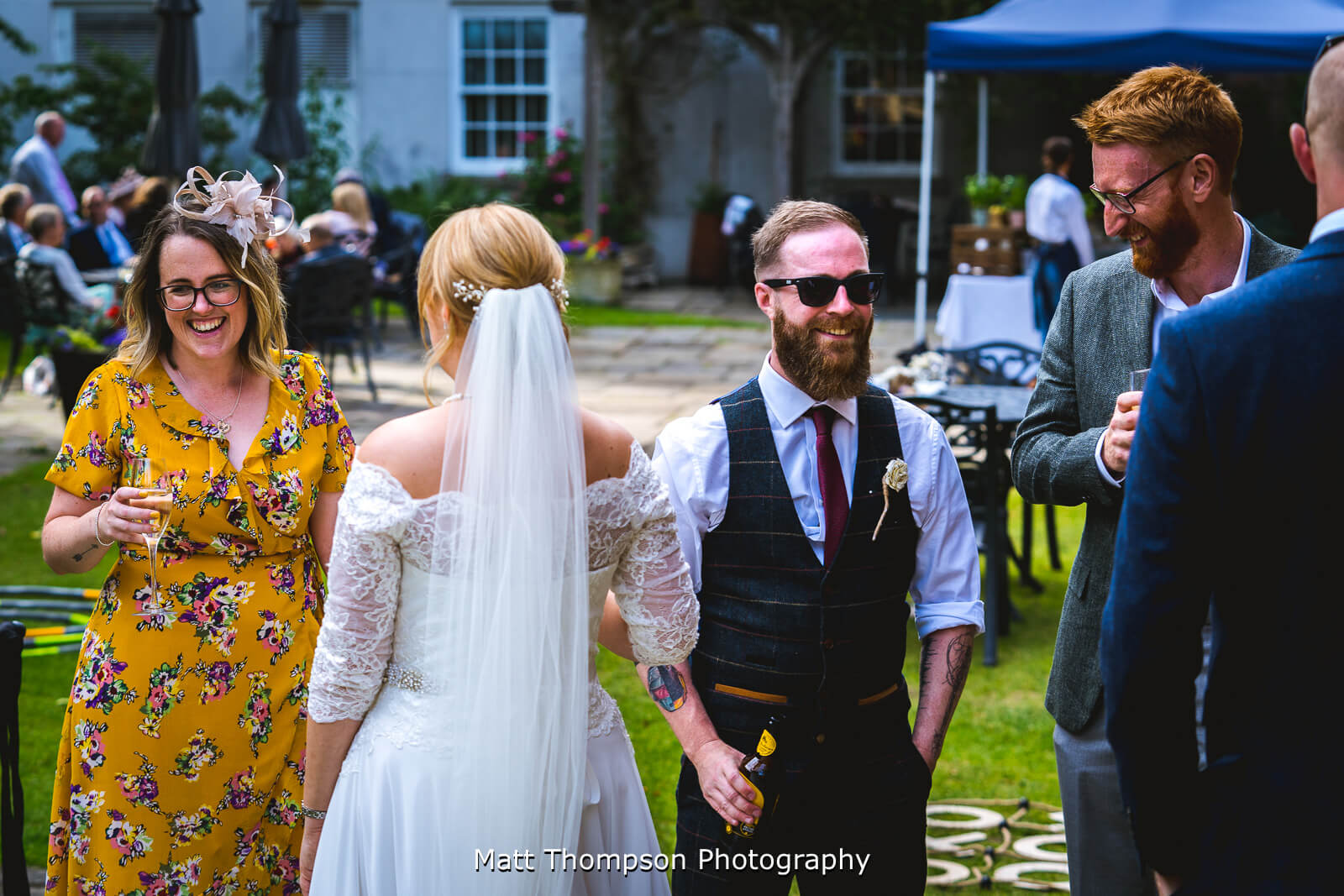 Bride and groom talking to guests