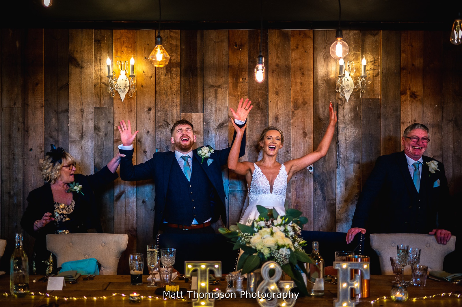 bride and groom cheering