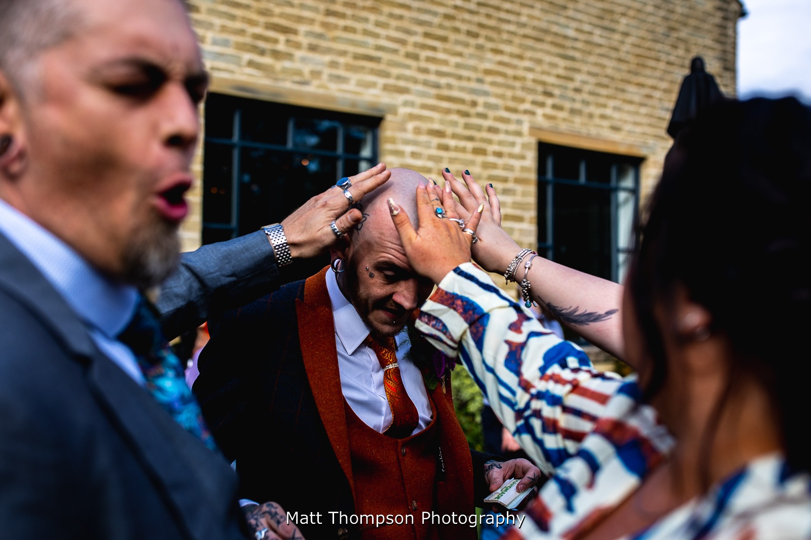 guests touching groom