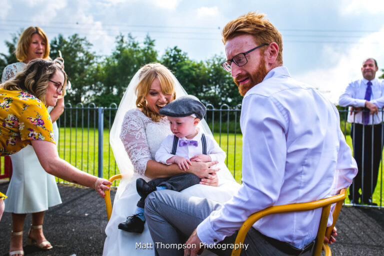 bride and groom on a roundabout