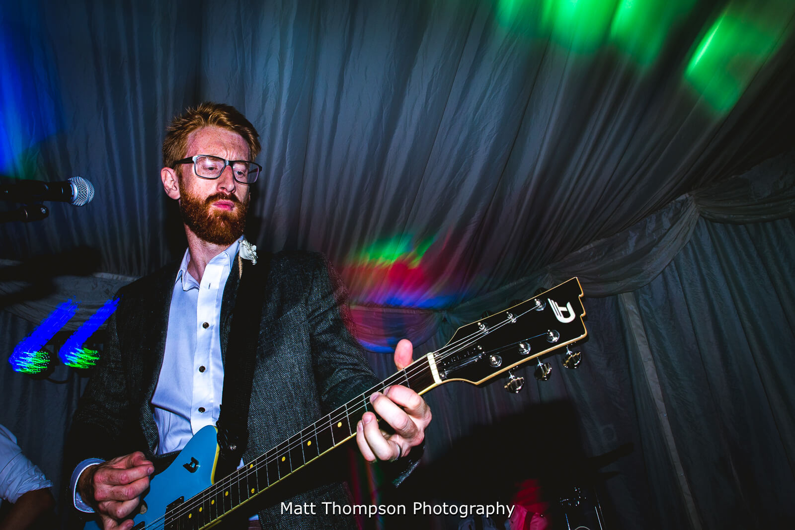 groom playing guitar