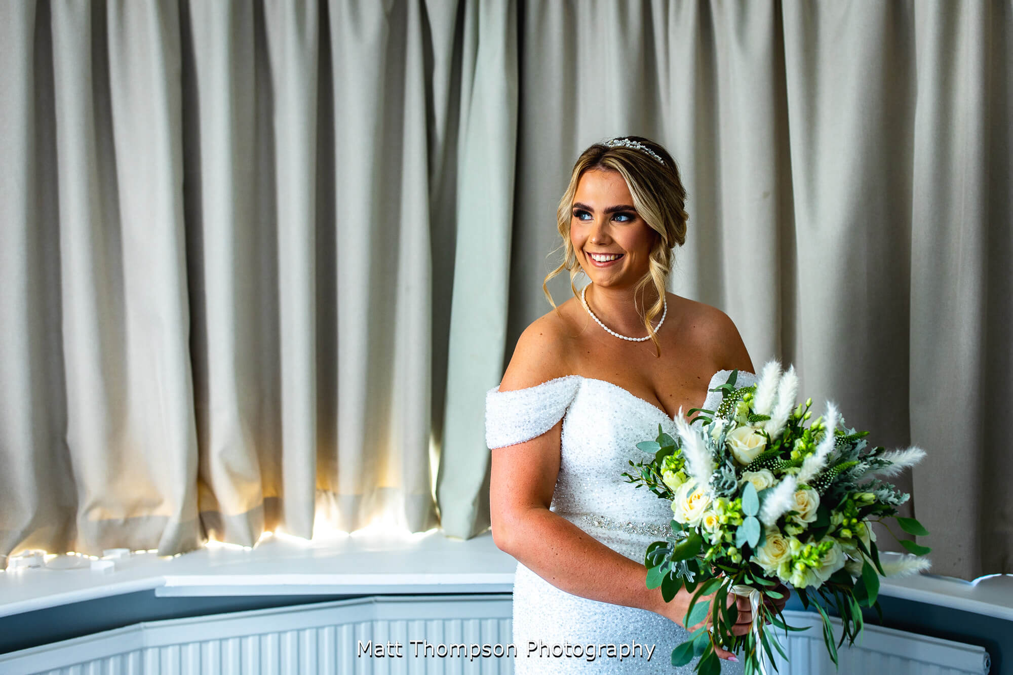 bride holding wedding bouquet