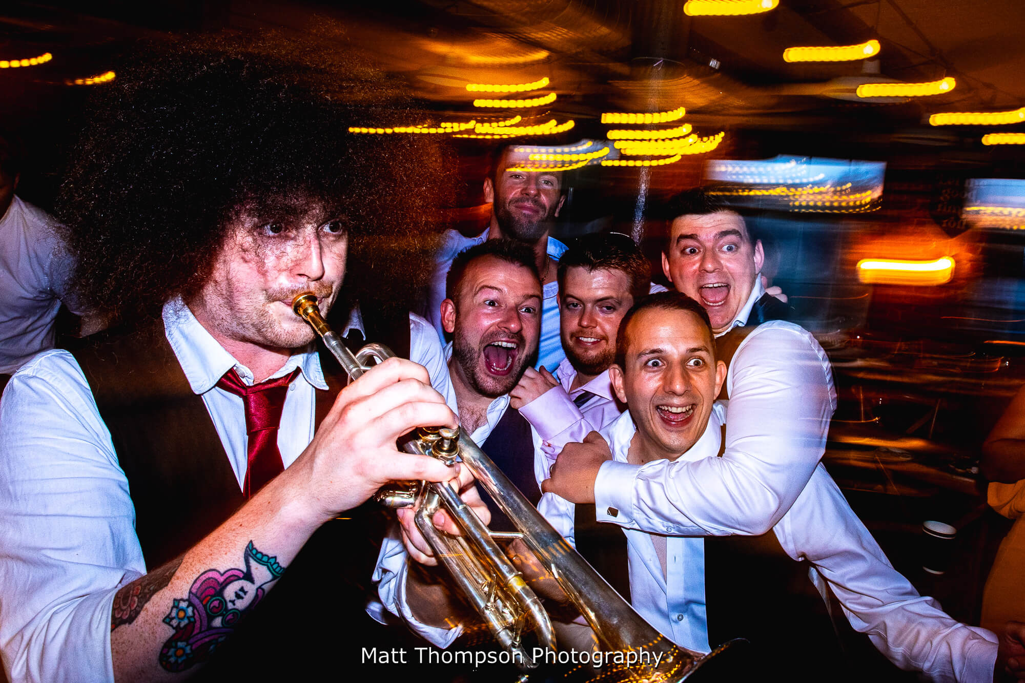 wedding party with back chat brass band