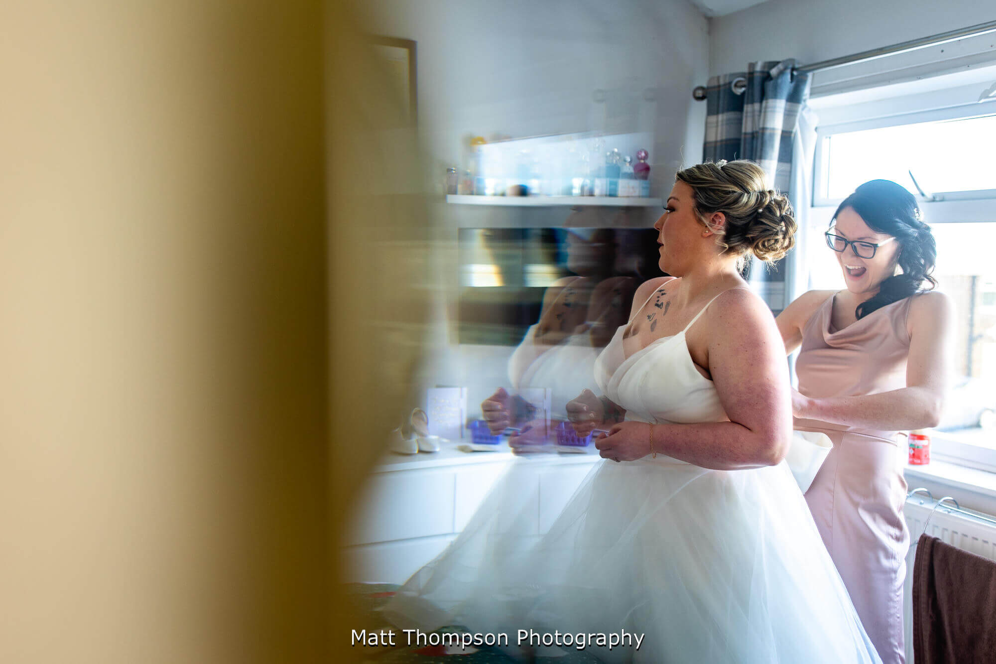 putting wedding dress on