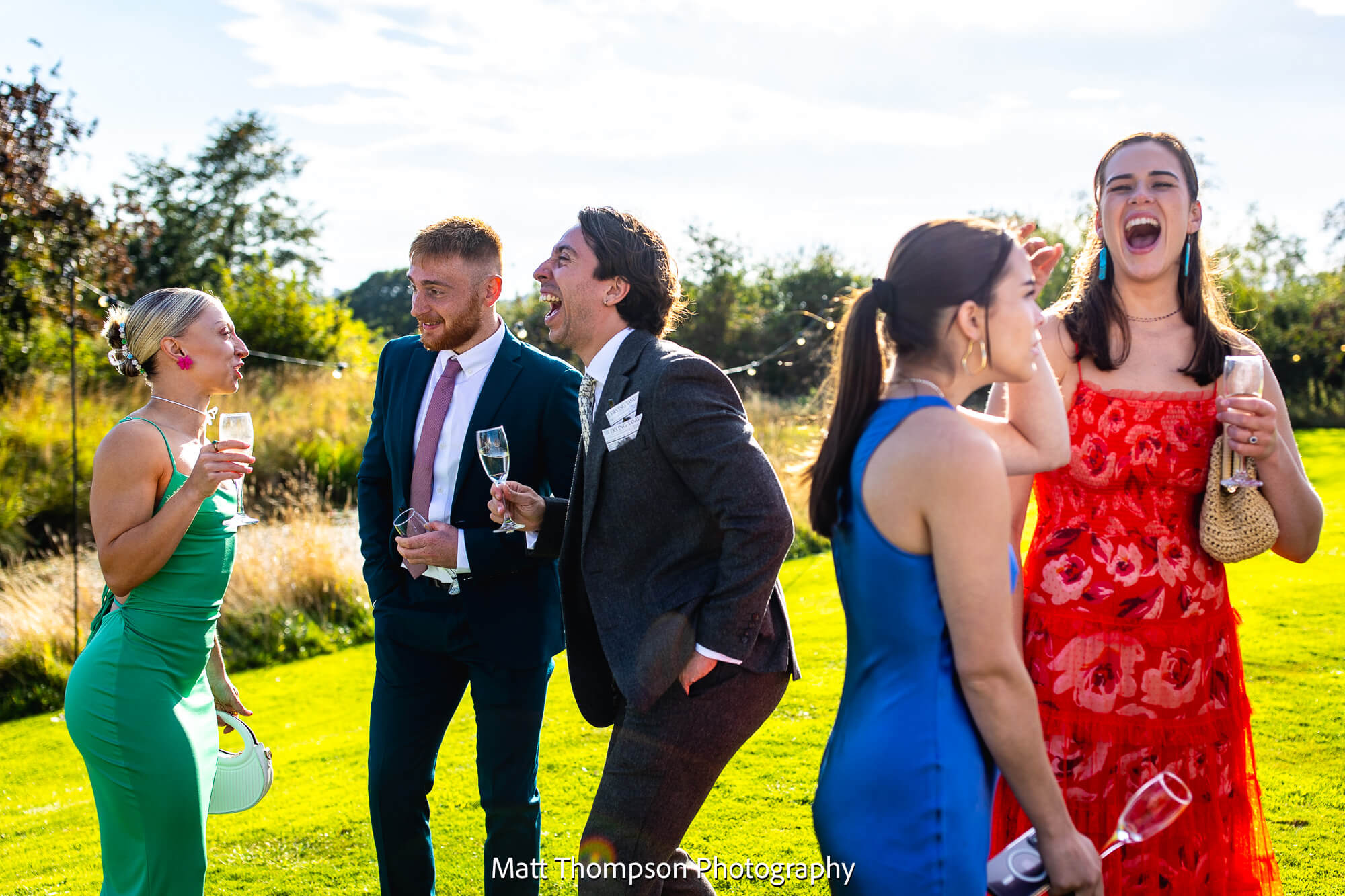 Wedding guests laughing