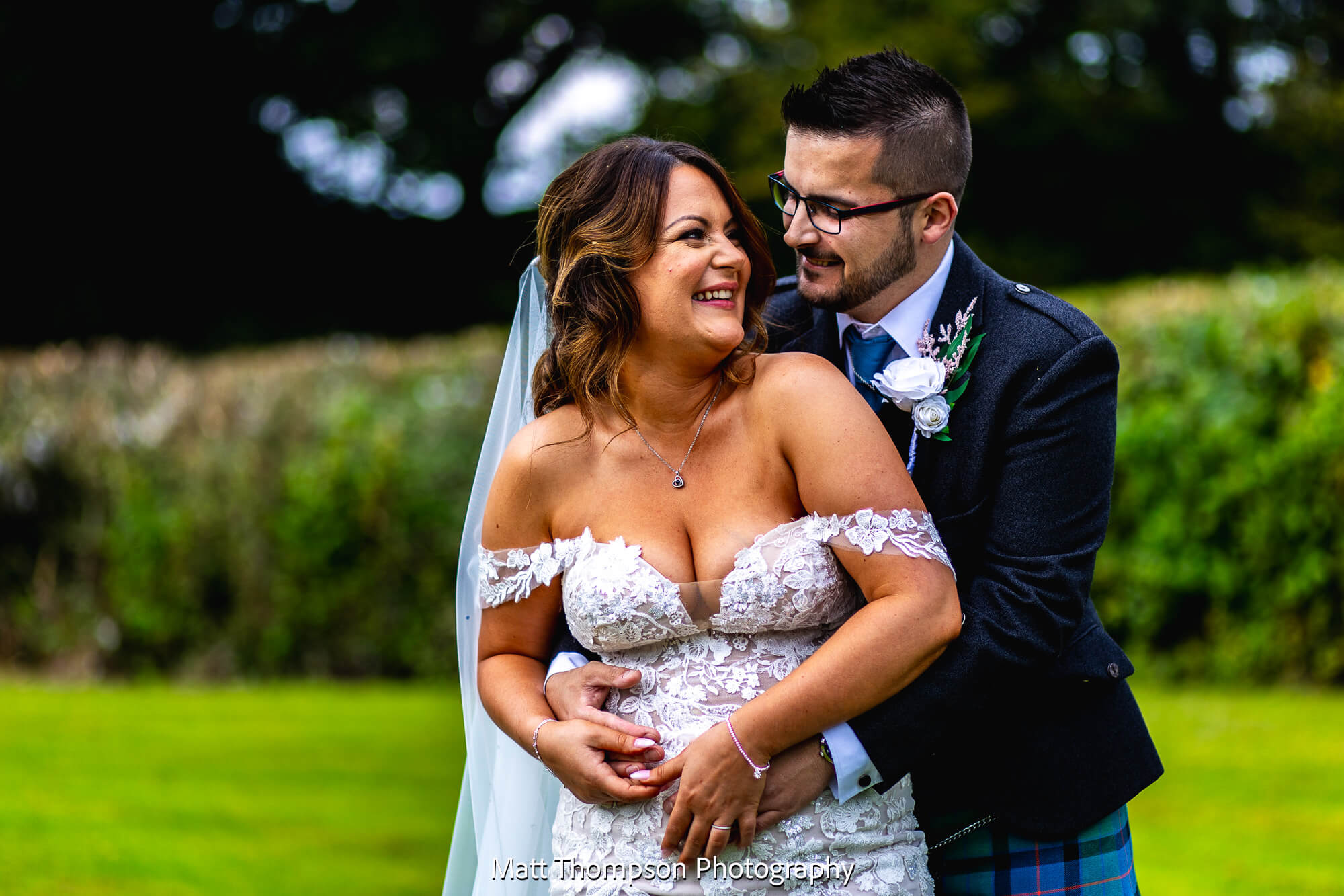 bride and groom laughing