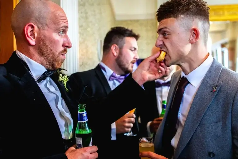 wedding guest eating canapes