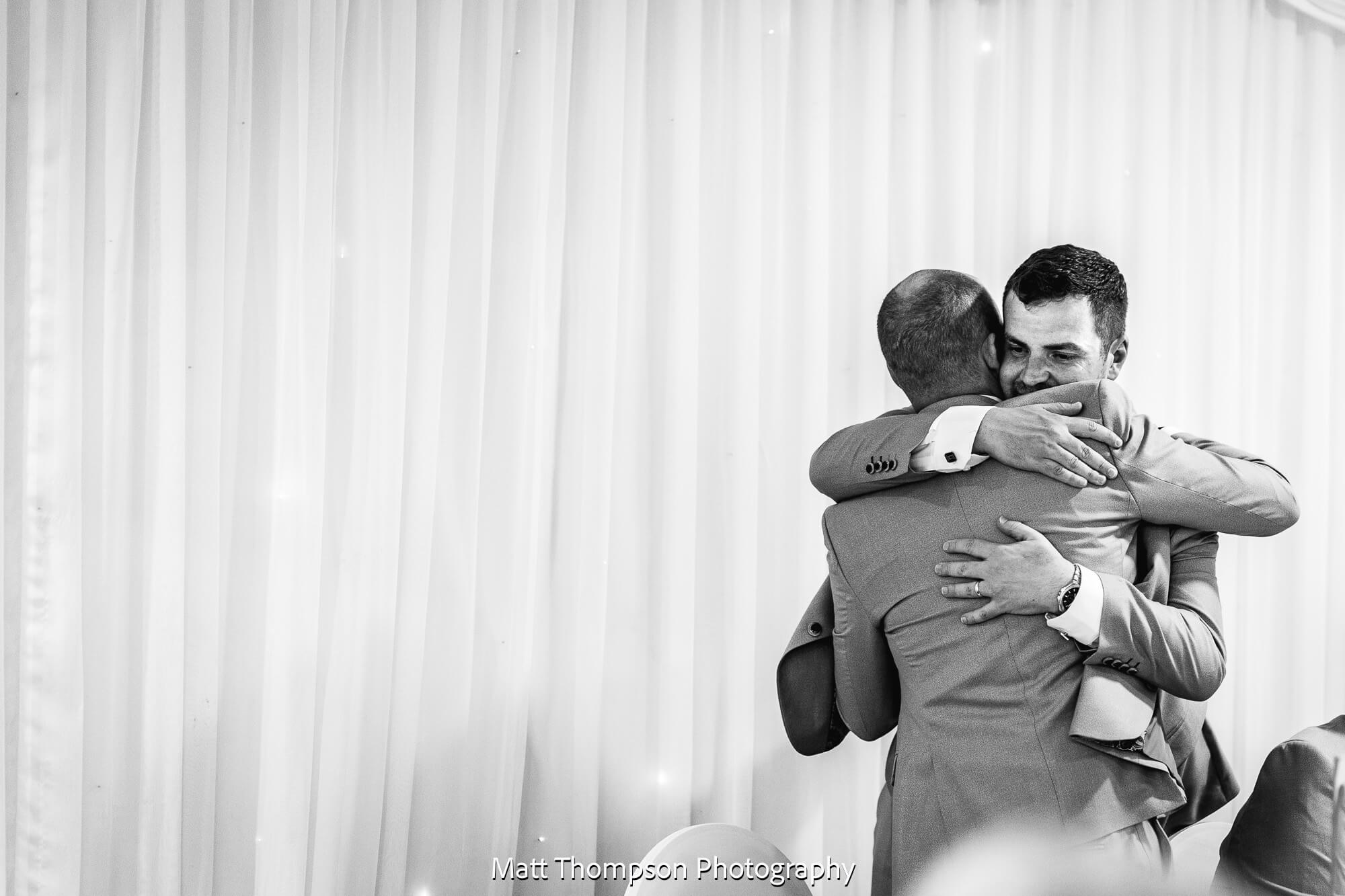 best man hugs