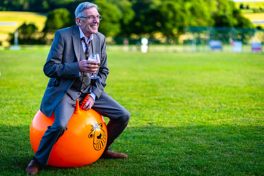 Wedding guest on a space hopper
